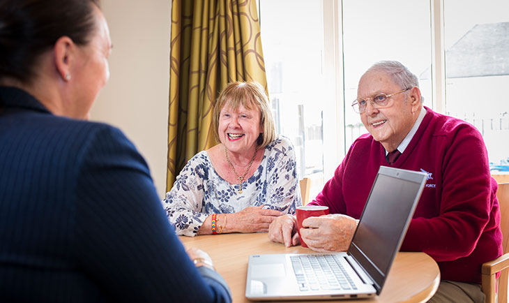 Photograph of customers working with A2Dominion staff