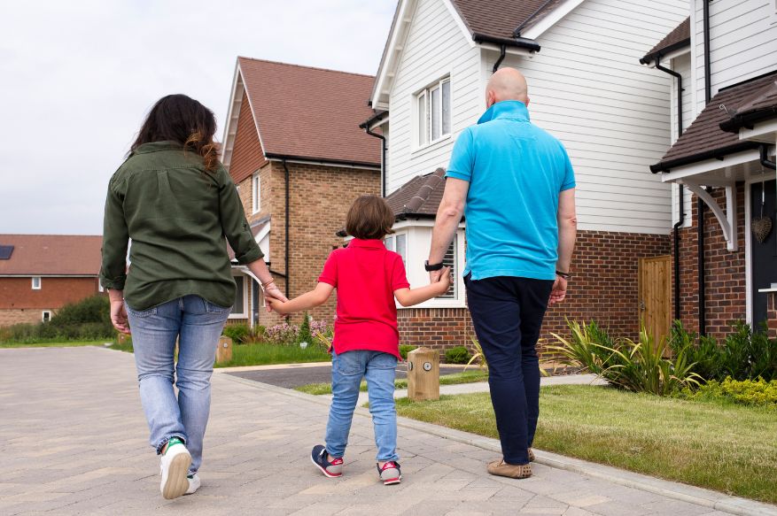 Family walking down a street